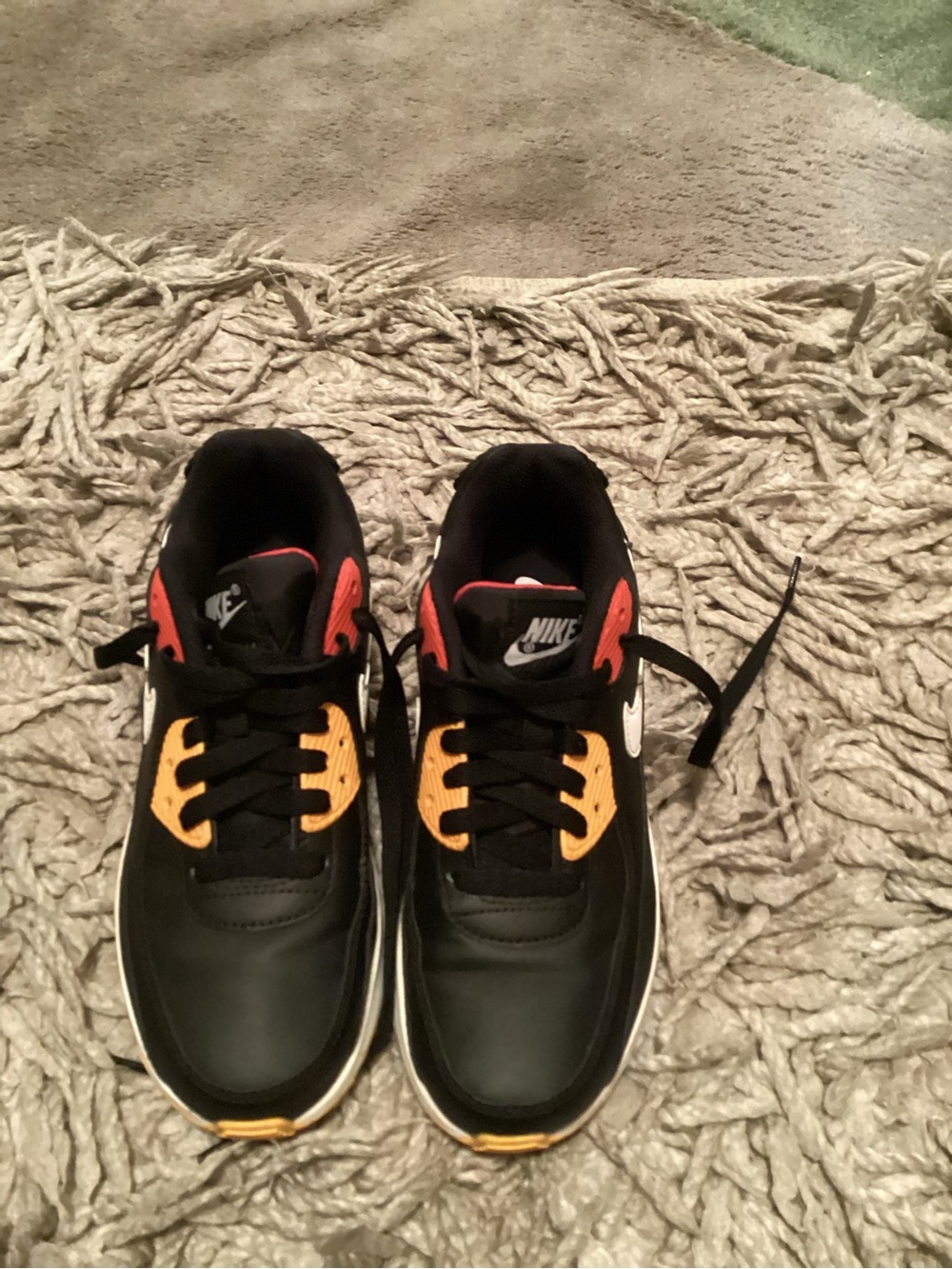 Nike Kids Black Sneakers with Orange & Red Accents